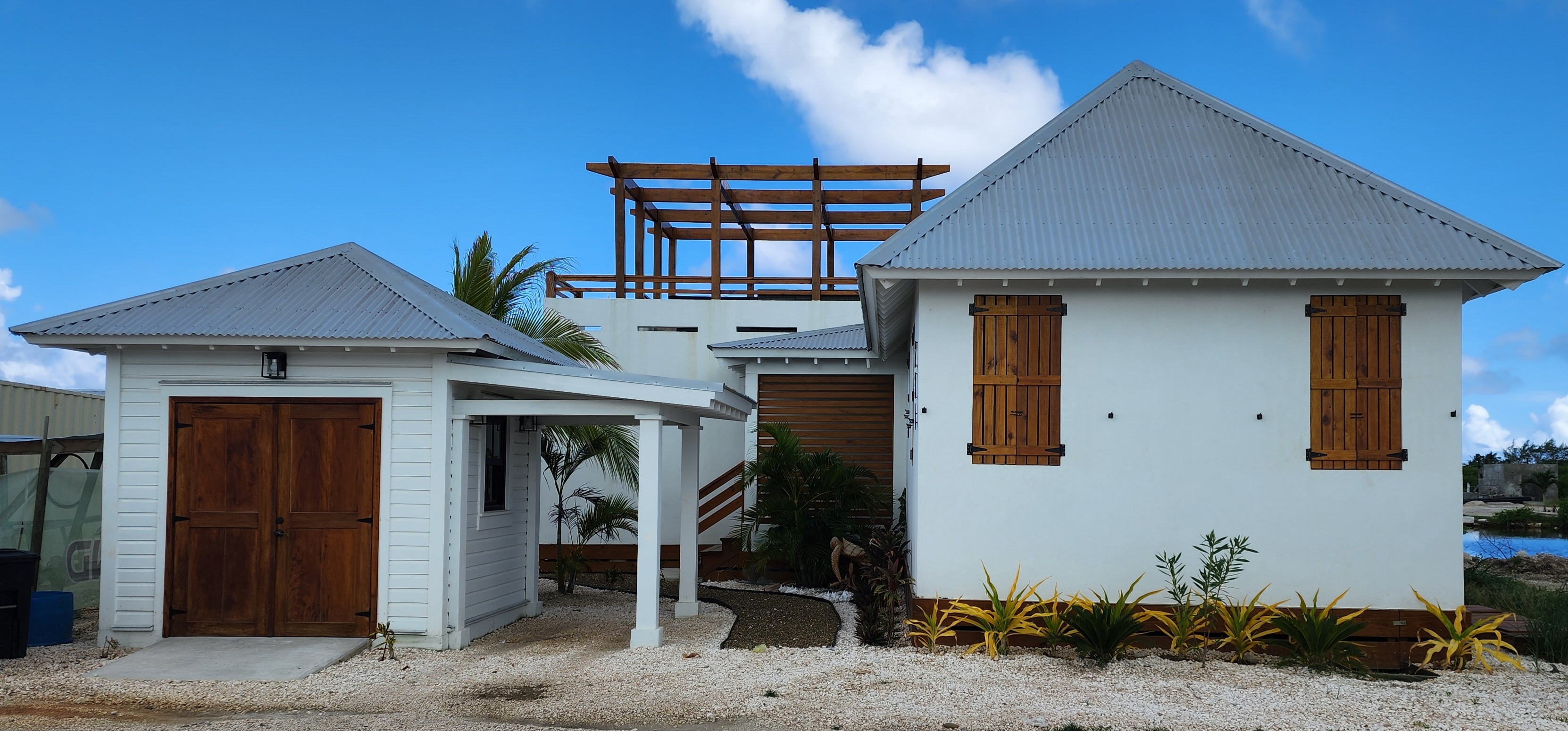 Traditional Belize cottage with hardwood door